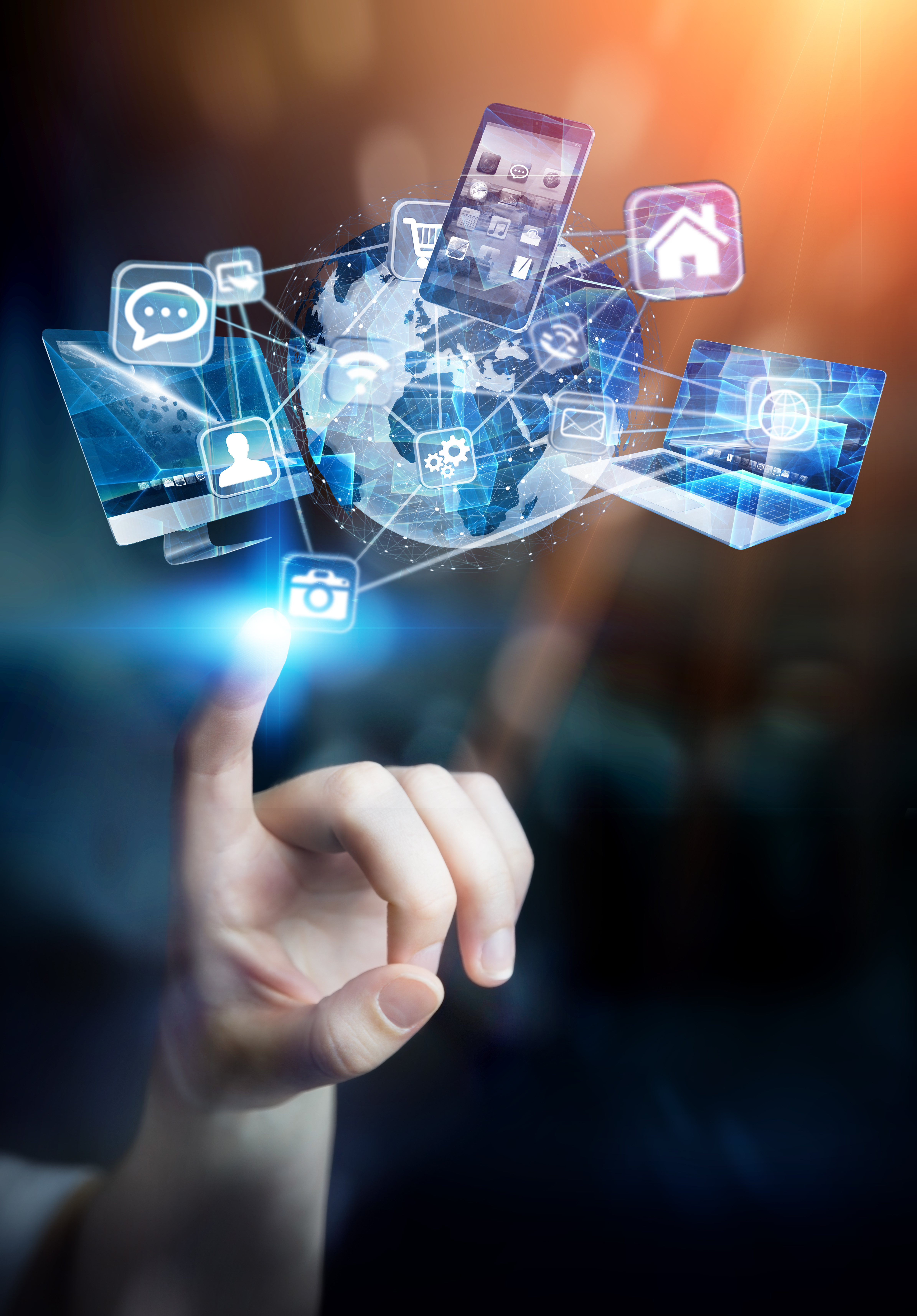 A hand reaches towards a floating, digital globe surrounded by various technology icons, including smartphones, laptops, and communication symbols, representing global connectivity and modern technology. The background features a gradient of light, enhancing the futuristic theme.