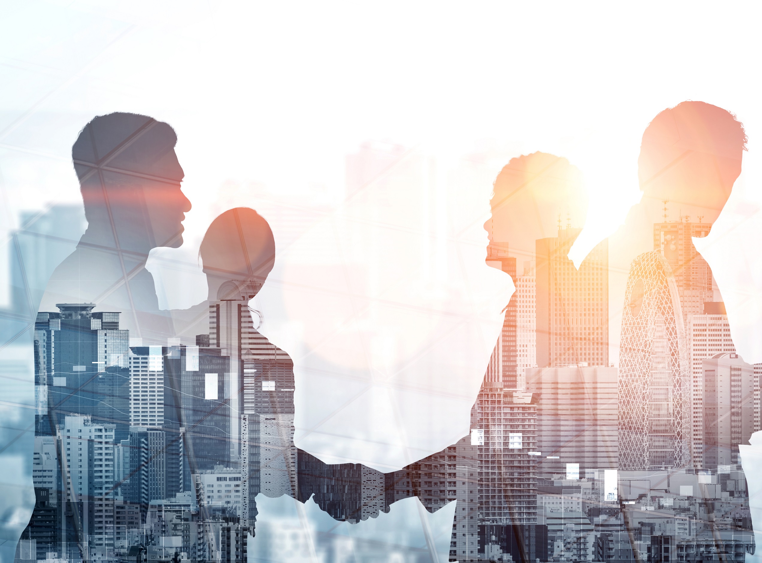 Silhouettes of two professionals engaging in a handshake, overlaid with a city skyline. The image conveys a sense of collaboration and partnership in a business environment, emphasizing professional connections against a backdrop of urban development.