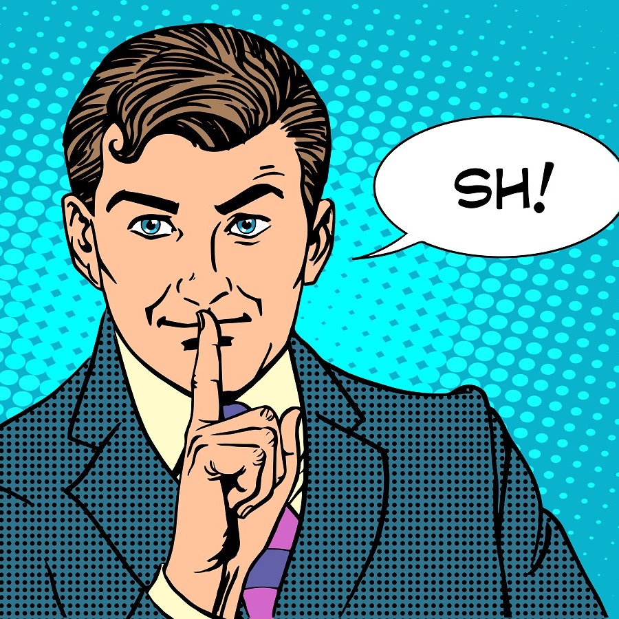 Ein Mann im Anzug hält einen Finger an die Lippen und macht eine "Pssst"-Geste. Er hat braune Haare und blaue Augen. Über ihm steht der Sprechblasentext "SH!". Der Hintergrund ist hellblau mit einem Punktmuster.
