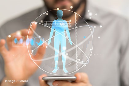 A person holds a smartphone, interacting with a holographic display showing a human figure surrounded by digital elements and data visualizations. The image symbolizes technology and health tracking, emphasizing advancements in personal health monitoring.