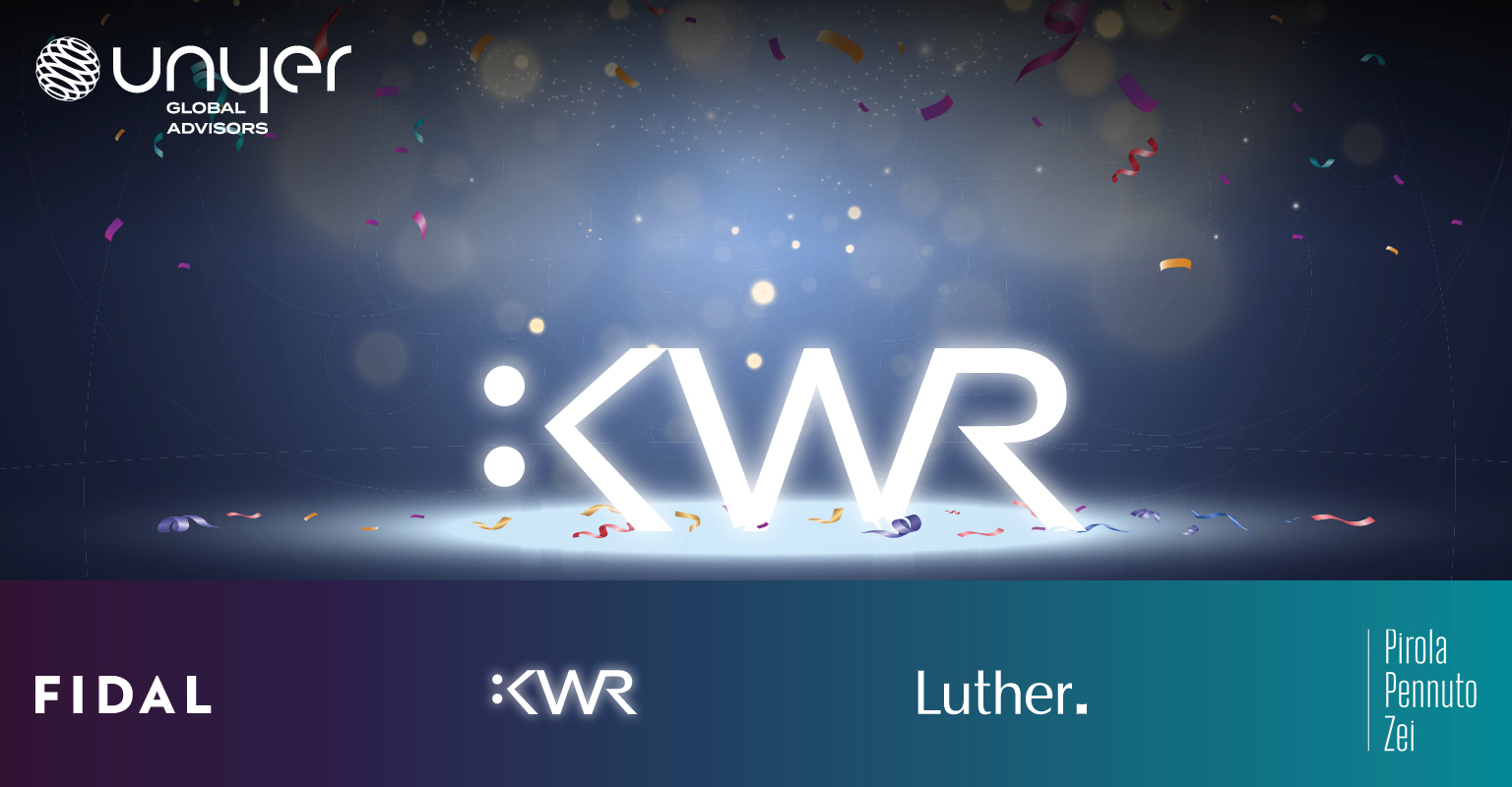 The image features the bold, illuminated text ":KWR" set against a subtle, dark background with scattered colorful confetti. Below, the names "Fidal," "Luther," and "Pirola Pennuto Zei" are displayed, suggesting a celebration or announcement related to these entities.