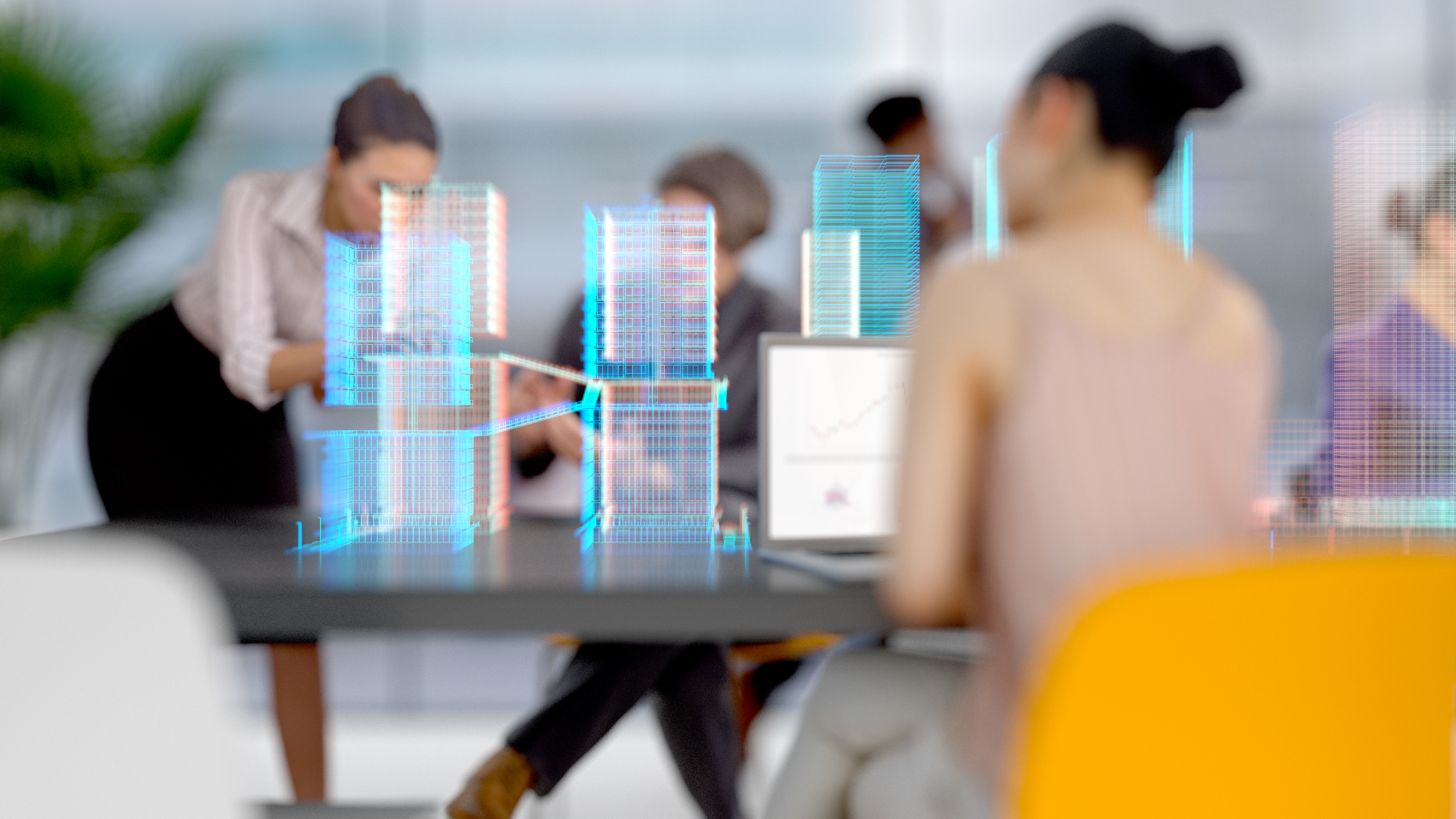 A group of professionals collaborates in a modern office setting. They are interacting around a table, with a laptop displaying a graph. holographic blueprints of buildings are projected above the table, illustrating a construction or architectural project.